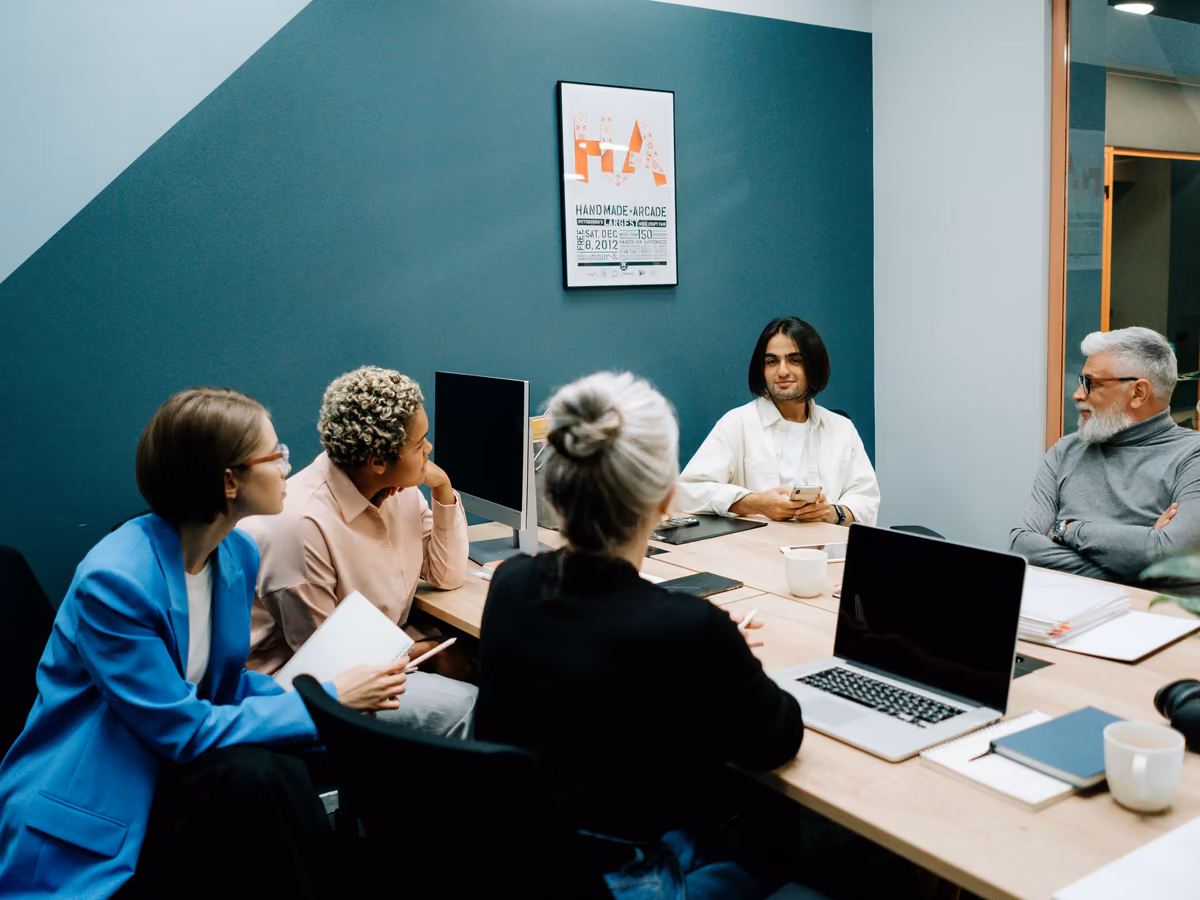 School staff around a table in a planning meeting